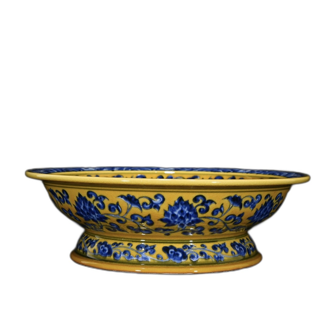 Ming Xuande Yellow Ground Blue and White Dragon and Phoenix Fruit Plate: Ming Xuande yellow ground blue and white dragon and phoenix pattern fruit plate, 8.5 cm in height, 27 cm in diameter. This fruit plate showcases exquisite dragon and phoenix designs in an elegant