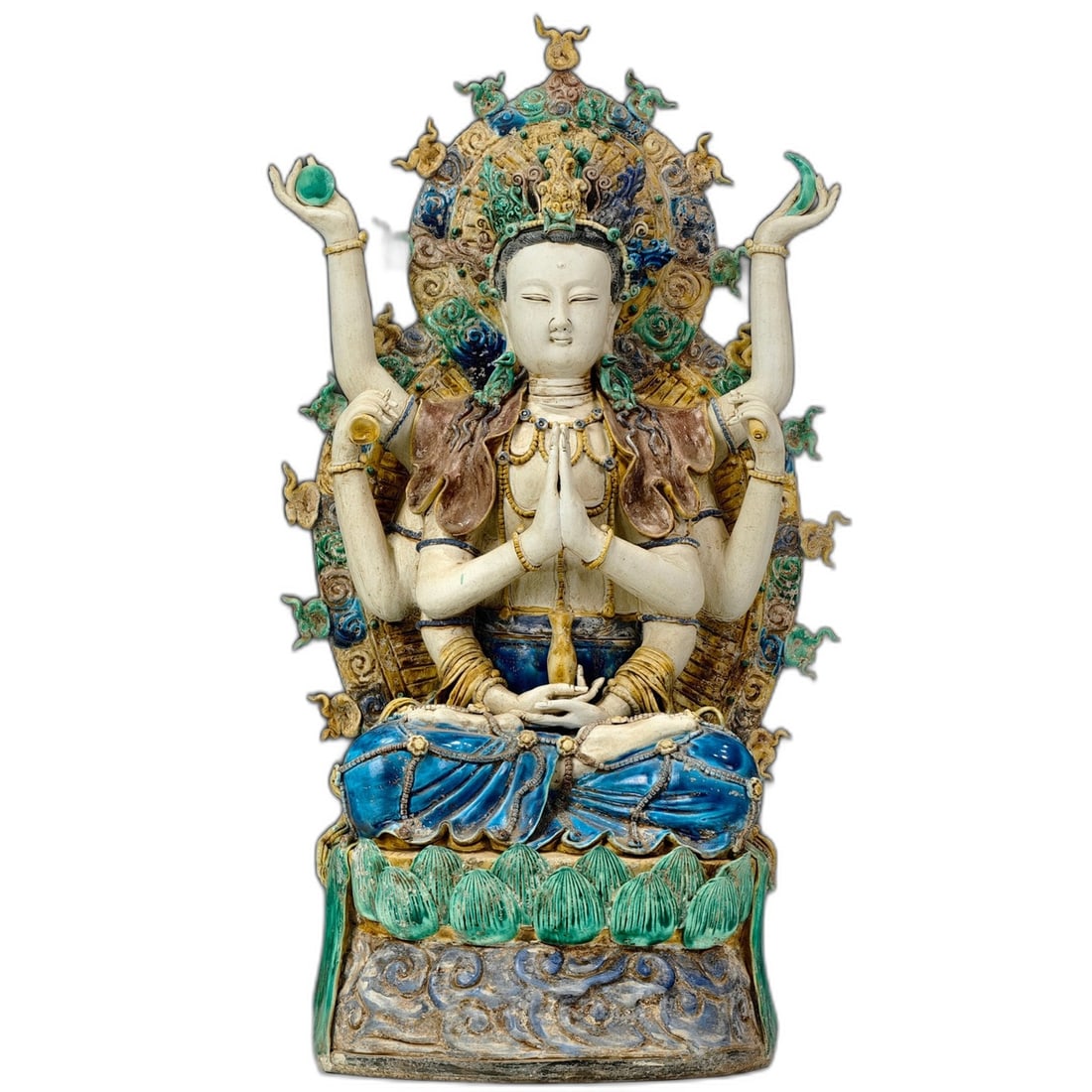 Yuan Dynasty Eight-Armed Guanyin Tricolor Statue: Yuan Dynasty Eight-Armed Guanyin Statue in Three-Color Glazed Pottery, finely sculpted and carved, depicting intricate details of the Buddha figure with delicate facial features, dignified