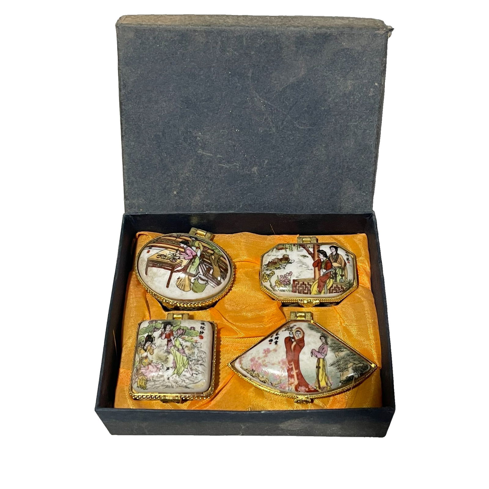 Porcelain Hand-painted Gilded Famille Rose Lady Jewelry Box: This set of collectible porcelain hand-painted jewelry boxes with gold powder highlights features exquisite craftsmanship and is in excellent condition. Each box depicts beautiful traditional women fi