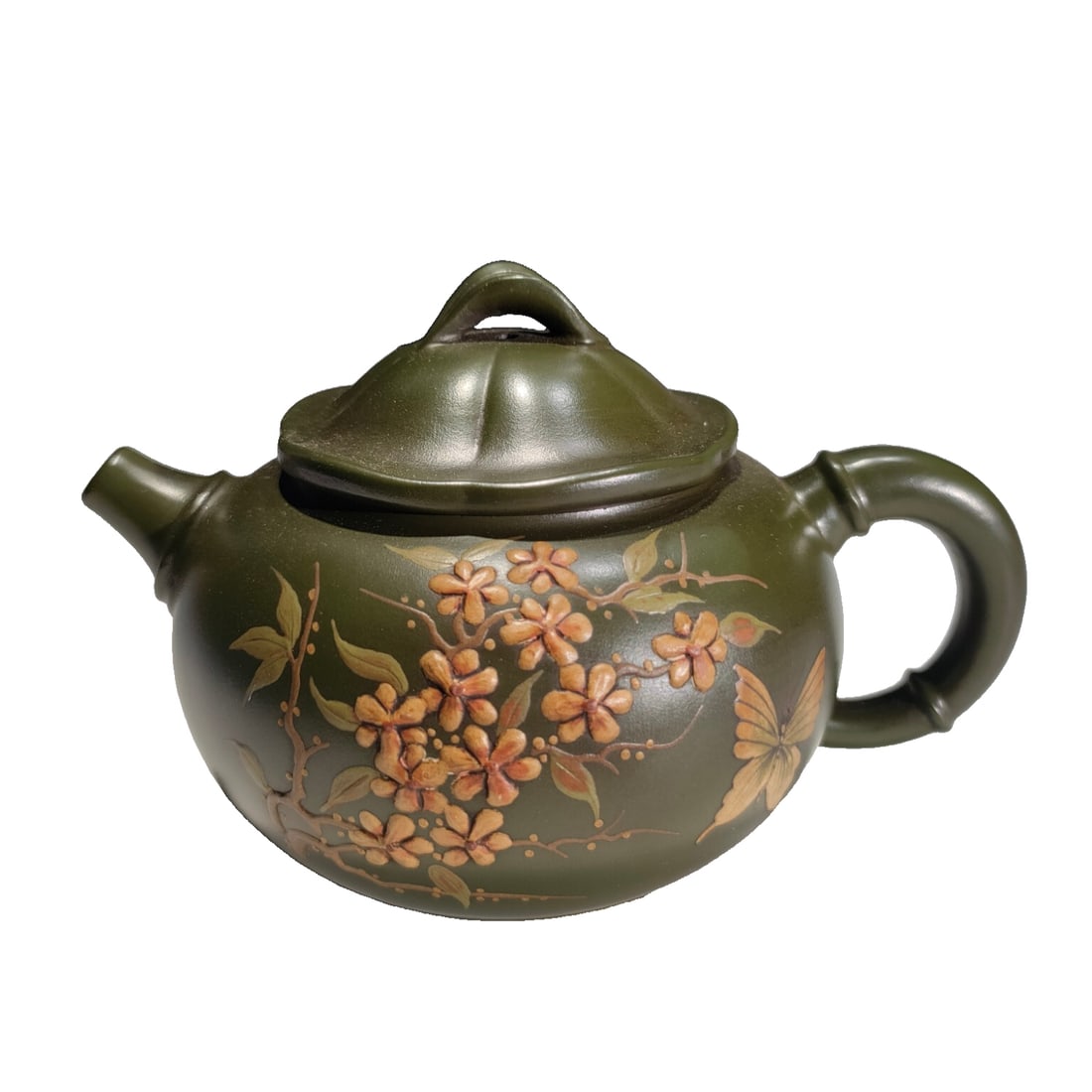 Old Zisha Teapot with Plum Blossom Relief: An antique multi-hole green Yixing clay teapot with a relief of plum blossoms, featuring a natural patina and preserved in excellent condition, making it a fine collectible piece. The dimensions are