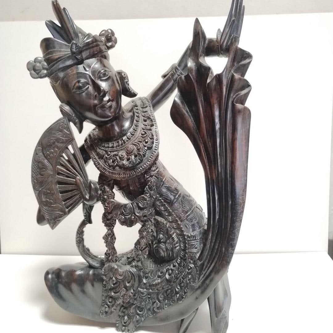 Traditional Balinese Craft: Ebony Balinese Doll: Traditional Balinese Craft: Ebony Balinese Dolls The characteristics of ebony carvings are their deep black color and smooth texture. These carvings are exquisitely crafted, imparting a sense of