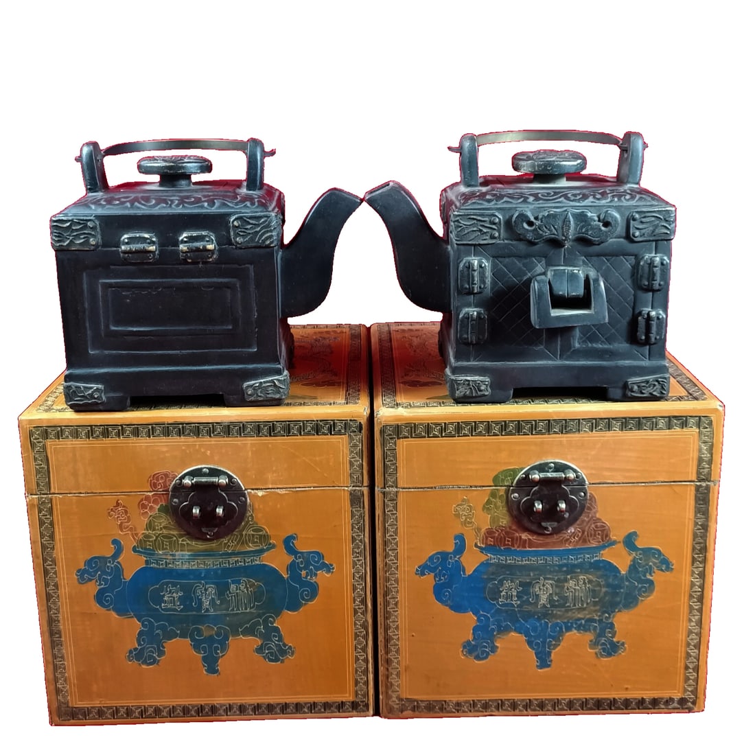 Antique Nanmu Lacquer Box with Lockhead Purple Clay Teapot: An antique collection of a nanmu lacquerware box containing a zisha teapot with a lock head. The piece is well-preserved, featuring intricate carving and an aged patina. The overall design is simple y