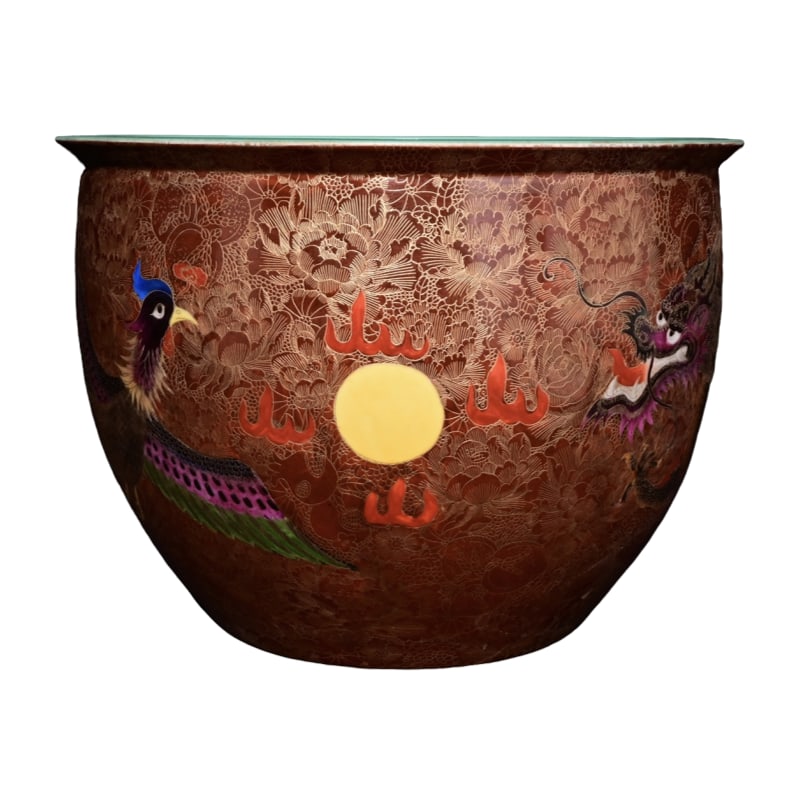 Qianlong Enamel Dragon Phoenix Vase: This enamel-painted jar with gold-incised dragon and phoenix motifs, symbolizing blessings and longevity, is marked from the Qianlong period of the Qing Dynasty. It stands 24.6 centimeters high with