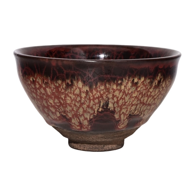 Song Jian Kiln Oil Spot Glaze Bowl: This Song Dynasty Jian ware tea bowl with "Yohen" glaze stands at a height of 7.4 centimeters and has a diameter of 12.6 centimeters. It is renowned for its unique "Yohen" glaze coloration. The surfac