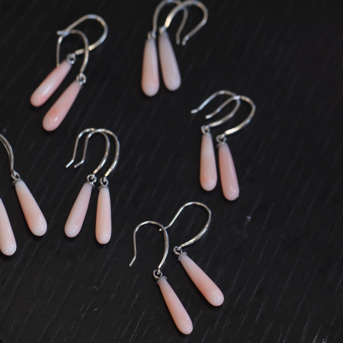 S925 Silver Natural Pink Coral Earrings: These earrings feature natural pink coral set in S925 silver. The teardrop-shaped coral exudes a subtle glow, paired with a minimalist silver hook for a fresh and elegant look. Perfect for pairing wit