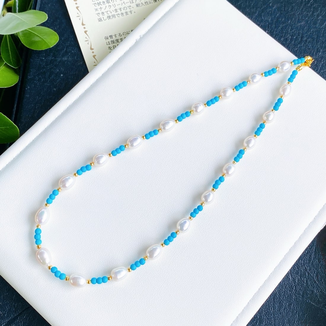 Pearl Necklace: Pearl Necklace, showcasing a perfect blend of rich gold and cool white. The large diameter pearls with minimal blemishes and perfect roundness offer a unique luster and texture, reminiscent of the oce