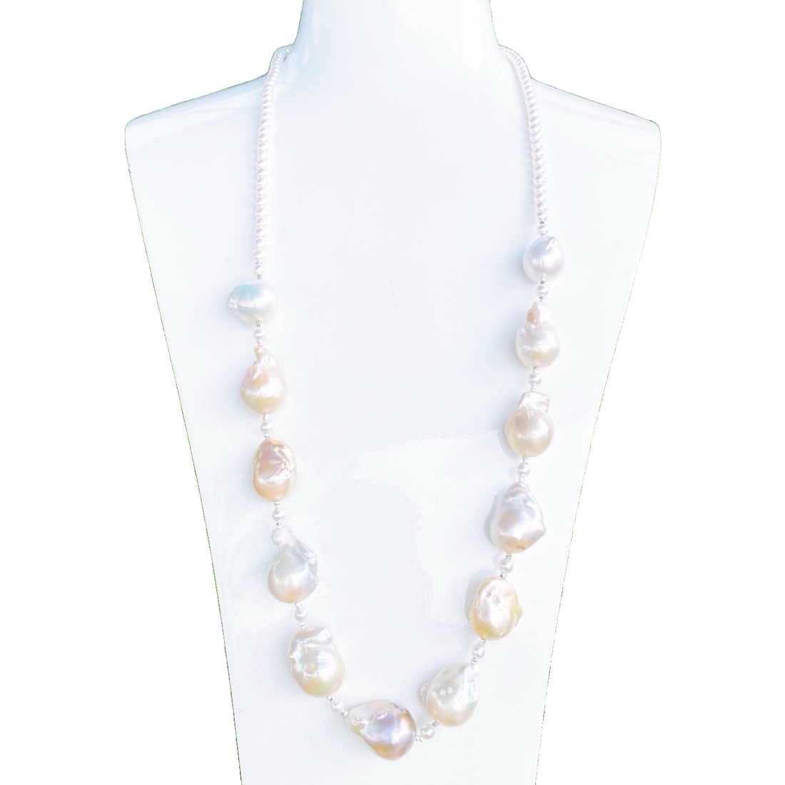Baroque Pearl Sweater Necklace: This Baroque Pearl Sweater Necklace is renowned for its unique dual-tone design, showcasing the natural luster of rich gold and cool white. The large diameter pearls create a perfect visual balance of