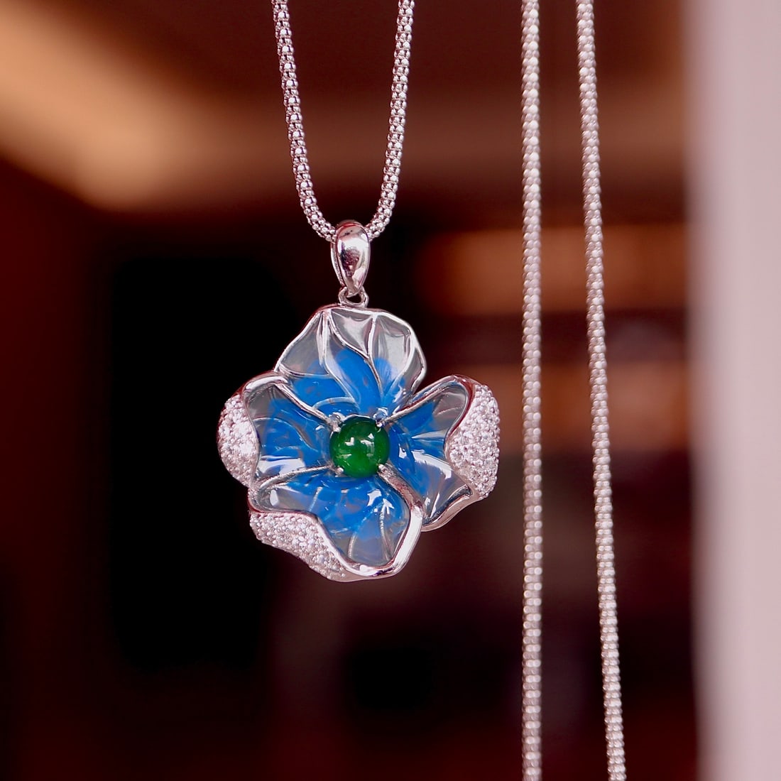 S925 Silver Natural Jade Pendant: This pendant features natural jade with a rich golden hue of icy green, set in S925 silver. The minimalist design is enhanced by the resin technique, highlighting the gemstone's cool white luster, mak