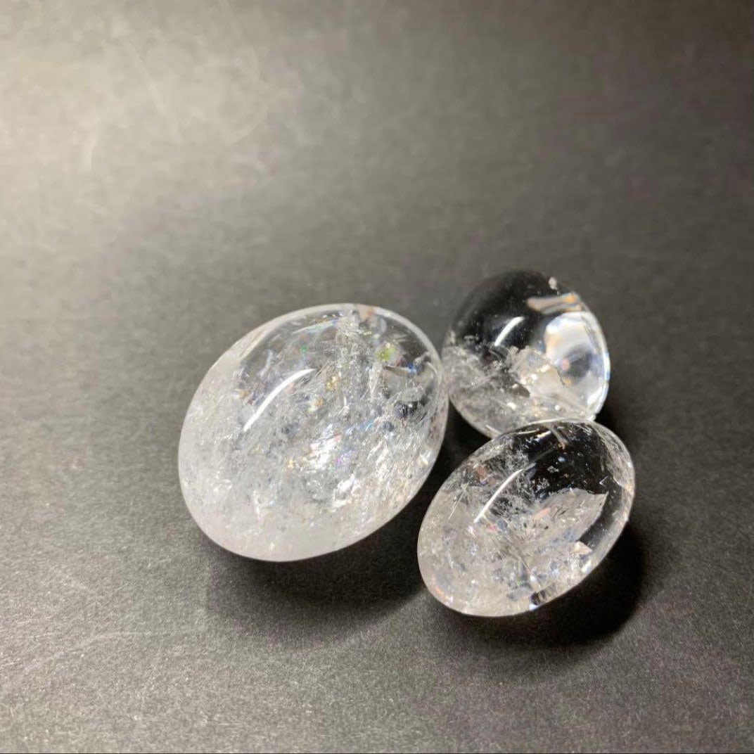 Three-piece Set of Holy Water Rainbow Infused Polished Quartz: Dragon Sacred Stone Set of Three: Holy Water Rainbow-Infused Polished Iridescent Quartz Iridescent Quartz (Rainbow Quartz) This enchanting natural gemstone combines the versatility of quartz with the