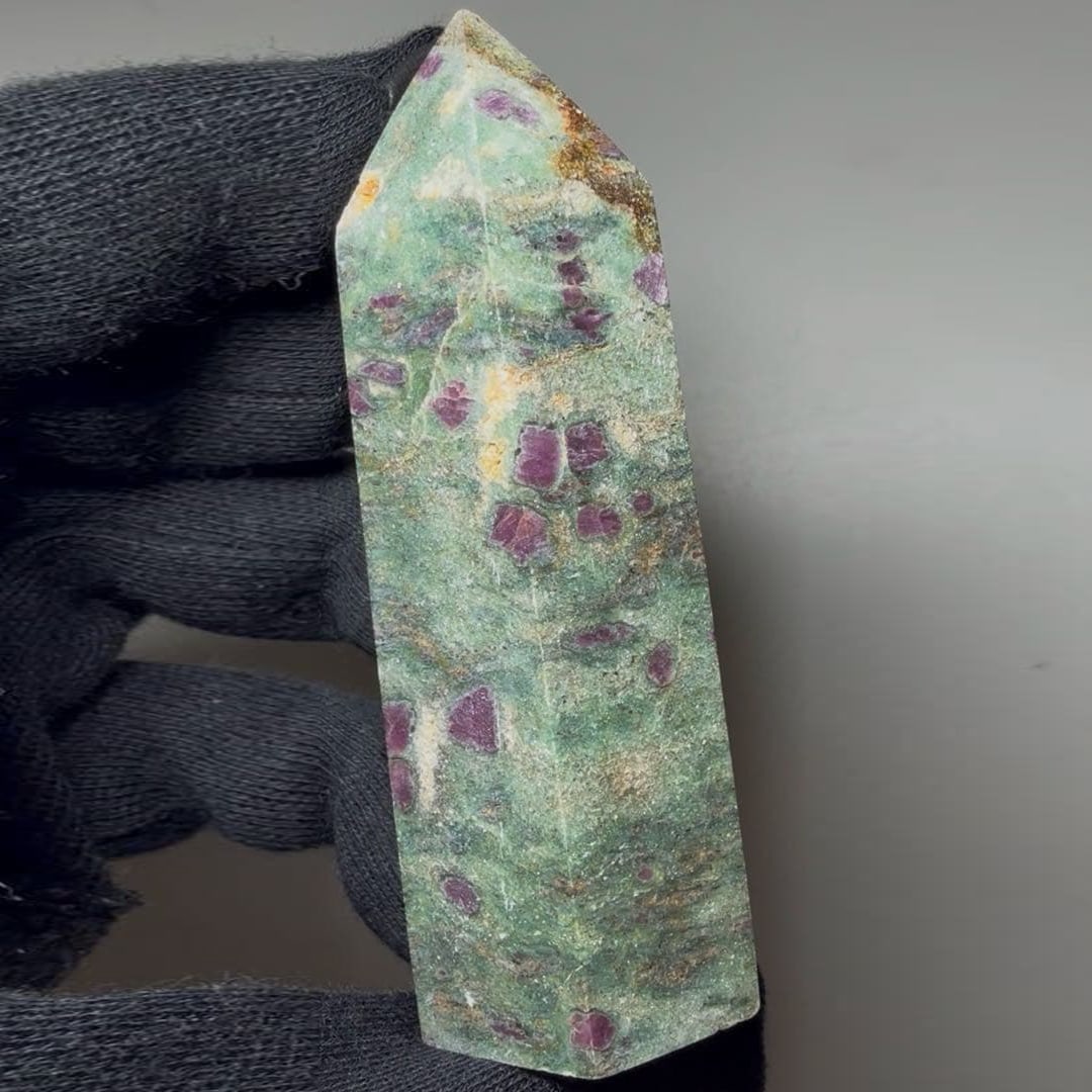 Hexagonal prism shape, natural gemstone.: Ruby Embedded in Chromian Mica Prismatic Crystal, Hexagonal Prism, Natural Gemstone This is a ruby situated within amethyst. It sparkles brilliantly throughout. Dimensions are approximately 27.3-28 x
