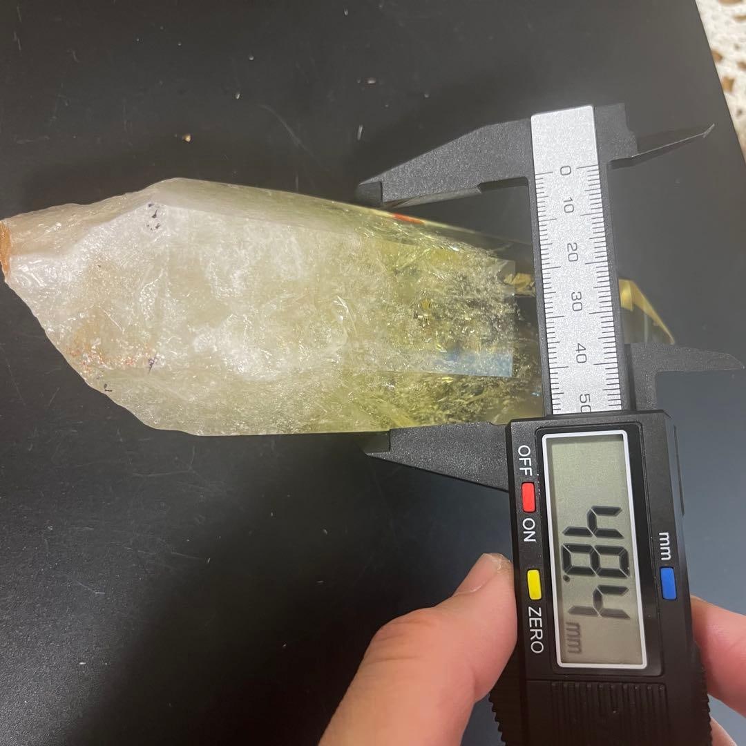 Yellow crystal column, hexagonal prism shape. - 19