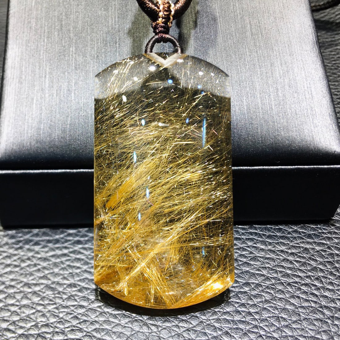 Natural Golden Rutilated Quartz Pendant: Natural Golden Rutilated Quartz Pendant, dimensions 46.3 x 25.8 x 9.4 mm, weight 21.6 grams. The "Wushi" pendant symbolizes peace and safety, representing tranquility and the fulfillment of all wishes