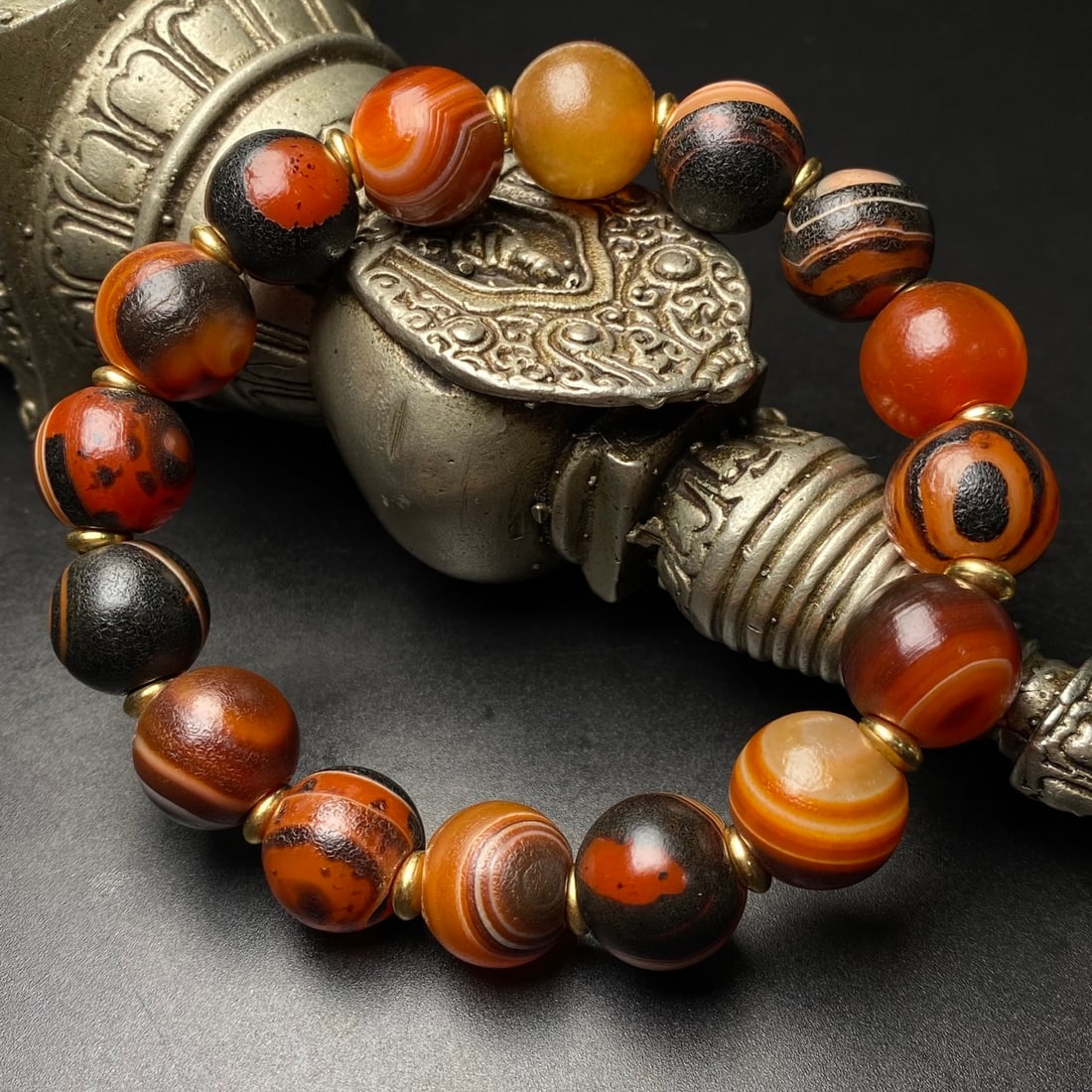 Striped Agate Eye Bracelet: Tianyan Agate Bracelet with Silk-like Bands, approximately 14mm in diameter with 16 beads. The agate is named for its delicate, thread-like color bands, which come in a variety of colors such as red a