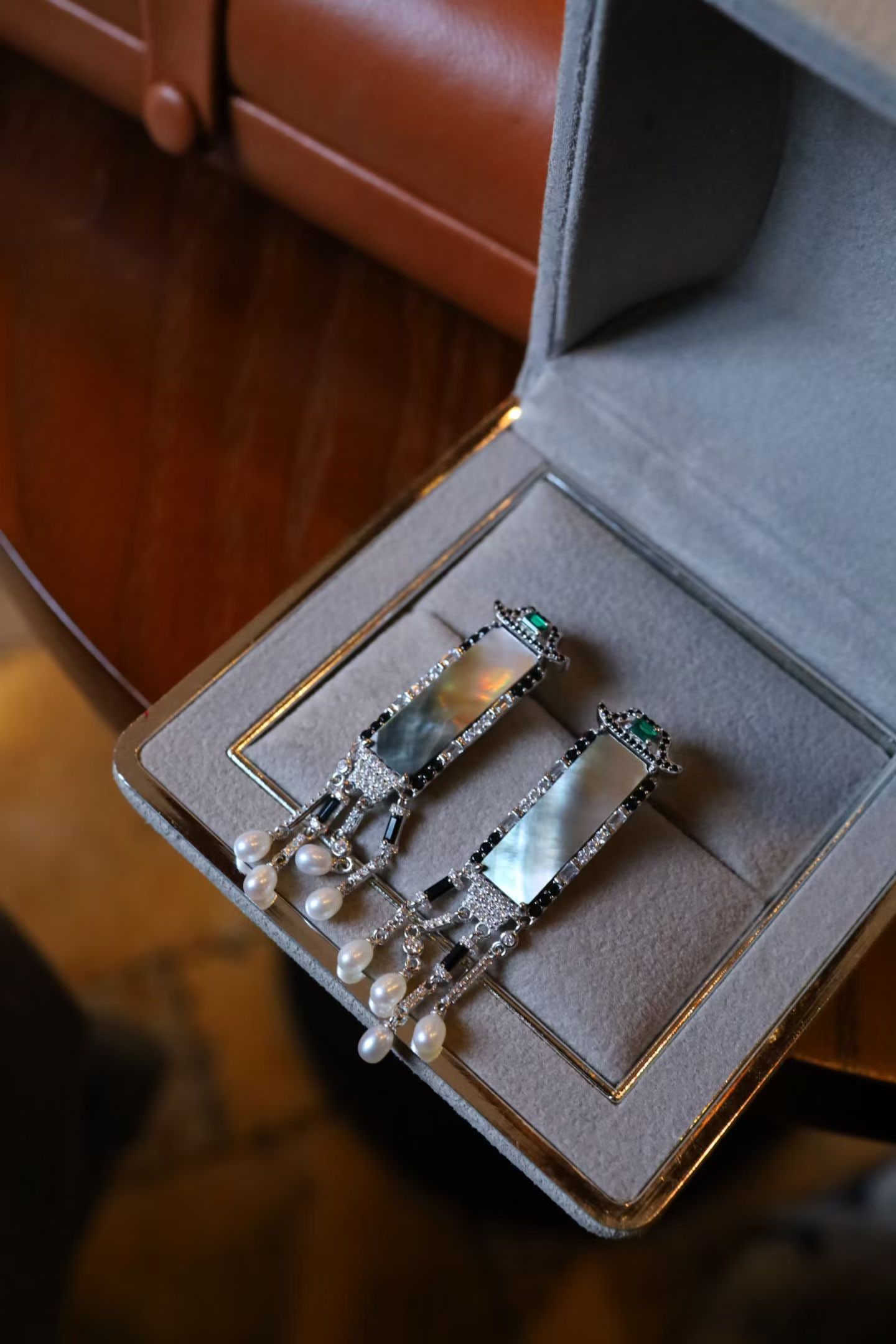 Sterling Silver Natural Black Mother-of-Pearl Earrings: Rectangular black mother-of-pearl, resembling a small piece of ink jade, showcases the subtlety of traditional Chinese design. Set in sterling silver, it exudes a fresh and natural charm, with a gentl