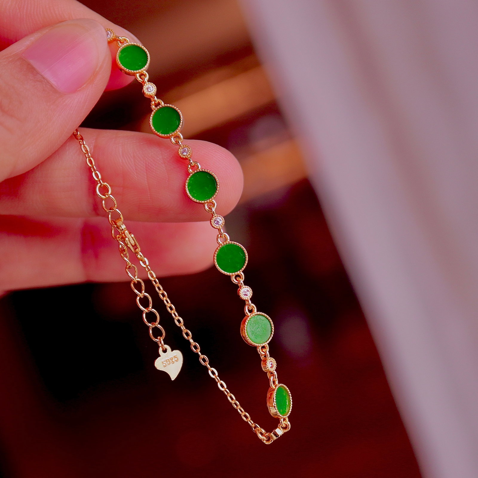 S925 Silver Natural Jadeite Round Pendant Bracelet: This bracelet features a natural jadeite round pendant, set in S925 silver, showcasing the vibrant color of the jadeite. The reverse side design symbolizes peace and joy, representing wealth and prosp