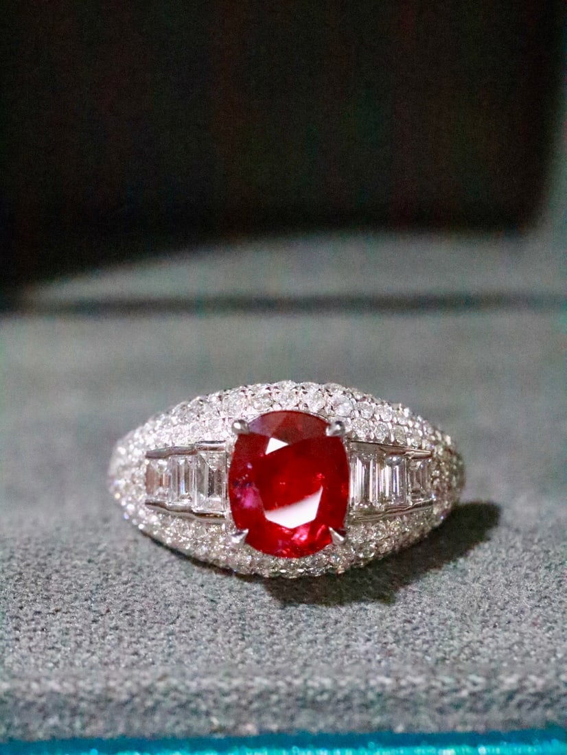 Platinum Natural Unheated Pigeon Blood Ruby Ring: This ring features an unheated pigeon blood ruby, showcasing captivating color and brilliance. Complemented by sparkling diamonds, the design is elegant and noble. The platinum material adds timeless 