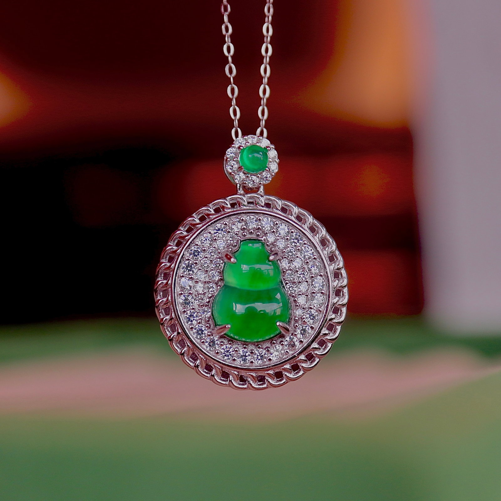S925 Silver Natural Jadeite Gourd Pendant: This natural jadeite gourd pendant is meticulously set in S925 silver, showcasing the high icy green hue of the jadeite. The simple and elegant design, with a gourd shape symbolizing prosperity and