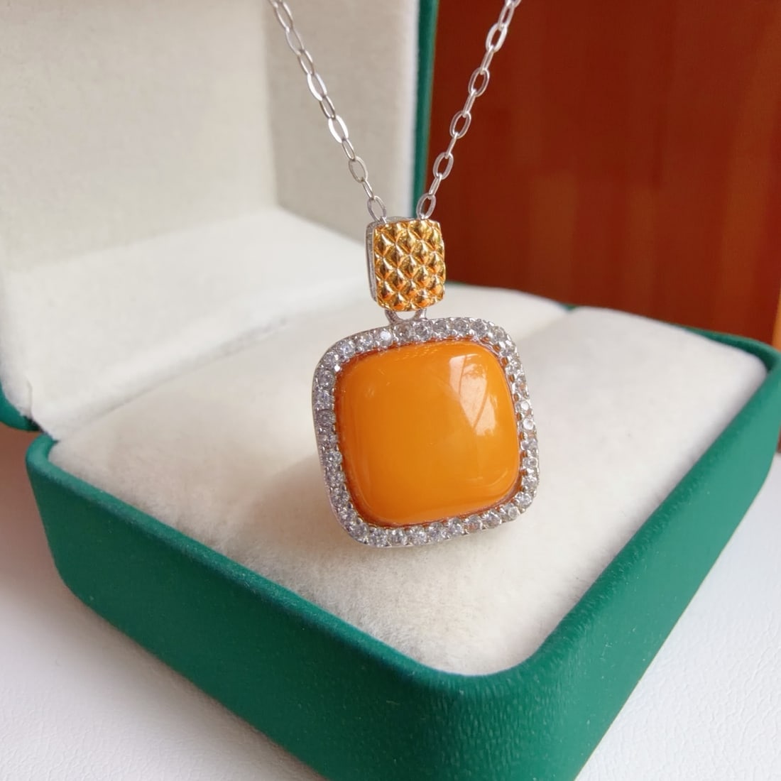 Natural Amber Pendant: This pendant features natural amber as the main stone, showcasing a warm hue. Set in S925 sterling silver, it exudes a simple yet elegant style. Suitable for various occasions, adding a touch of
