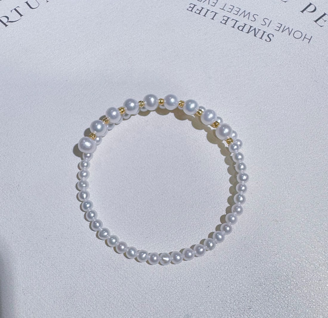 Natural Freshwater Pearl Bracelet: This bracelet features natural freshwater pearls, nearly round with a strong luster. The slightly blemished pearls enhance their natural beauty, perfect for elegant pairing. (Pearls 3-4 and 5-6mm) Fre