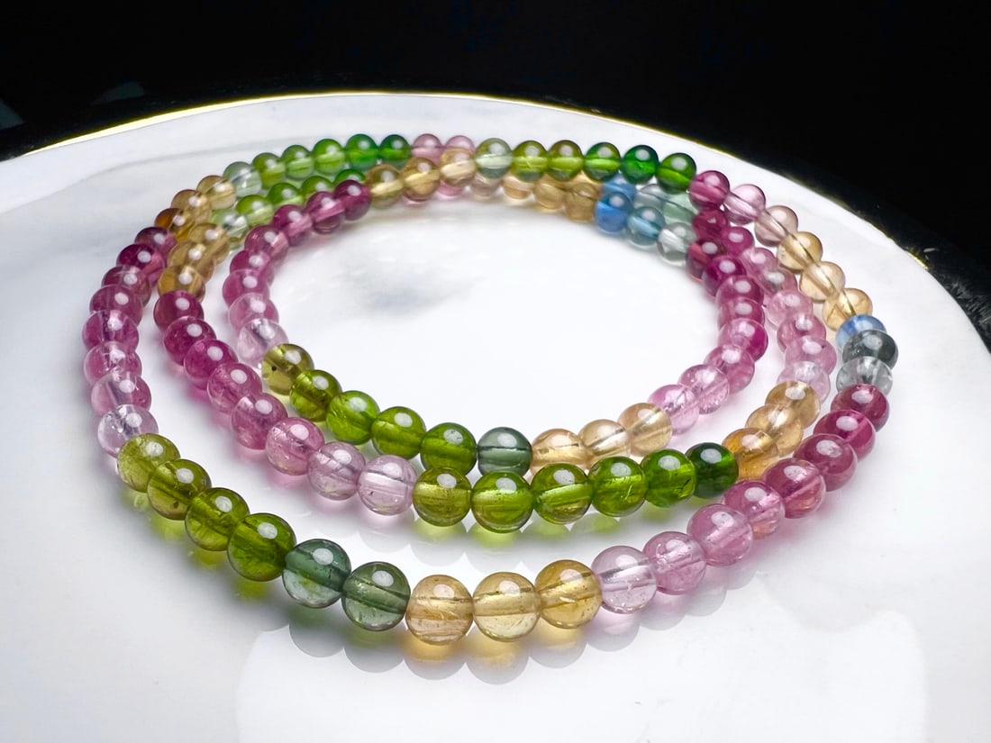 Natural Tourmaline Bracelet: This natural tourmaline bracelet features a multi-circle design, showcasing the natural colors and luster of tourmaline. Each bead is carefully selected to ensure its purity and beauty. Suitable for v