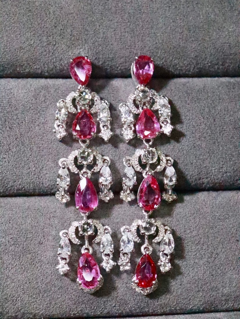 18K Gold Natural Unheated Ruby Earrings: These earrings are crafted in 18K gold, featuring natural unheated rubies that exude an elegant aura. The vibrant color of the rubies is captivating, complemented by diamond accents for added luxury. 