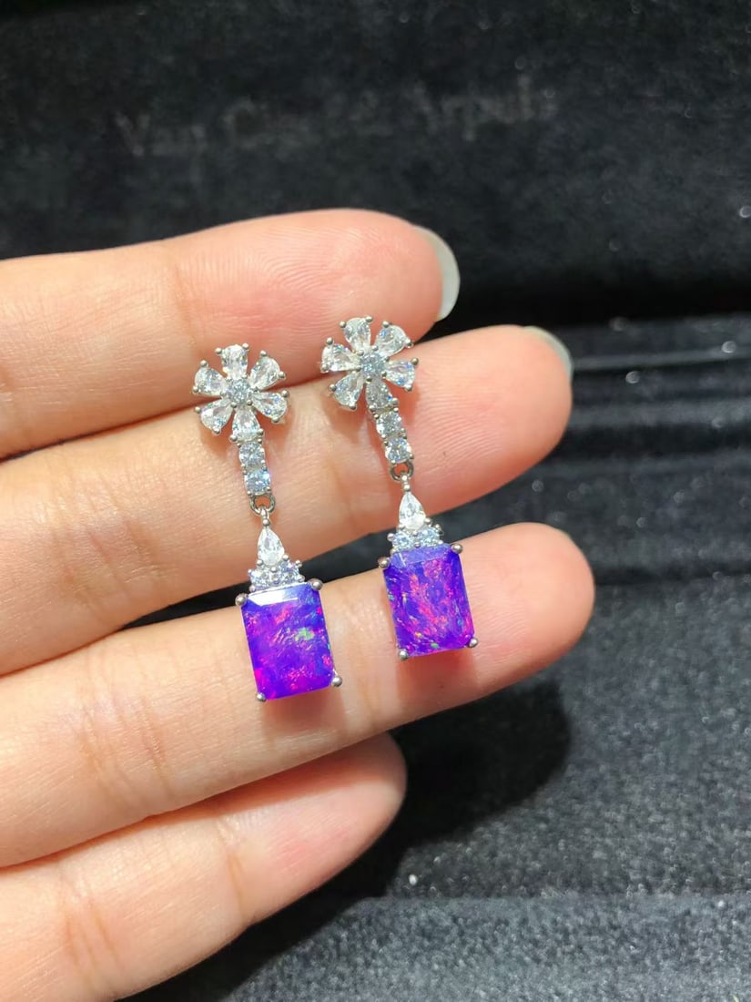 S925 Silver Dreamy Purple Opal Earrings: These earrings feature dreamy purple opals as the main stones, showcasing enchanting color variations. Expertly set in S925 silver, they exude elegance and nobility. The main stones are