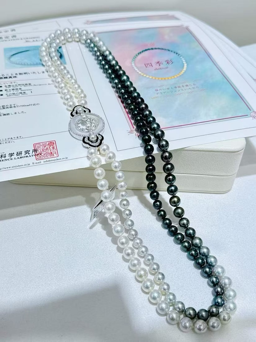 18K White Gold Diamond Hair Pearl Necklace: This necklace features 18K white gold with diamond inlays, showcasing an elegant black and white gradient design. The hair pearls exhibit a strong luster with minor blemishes, perfect for pairing with