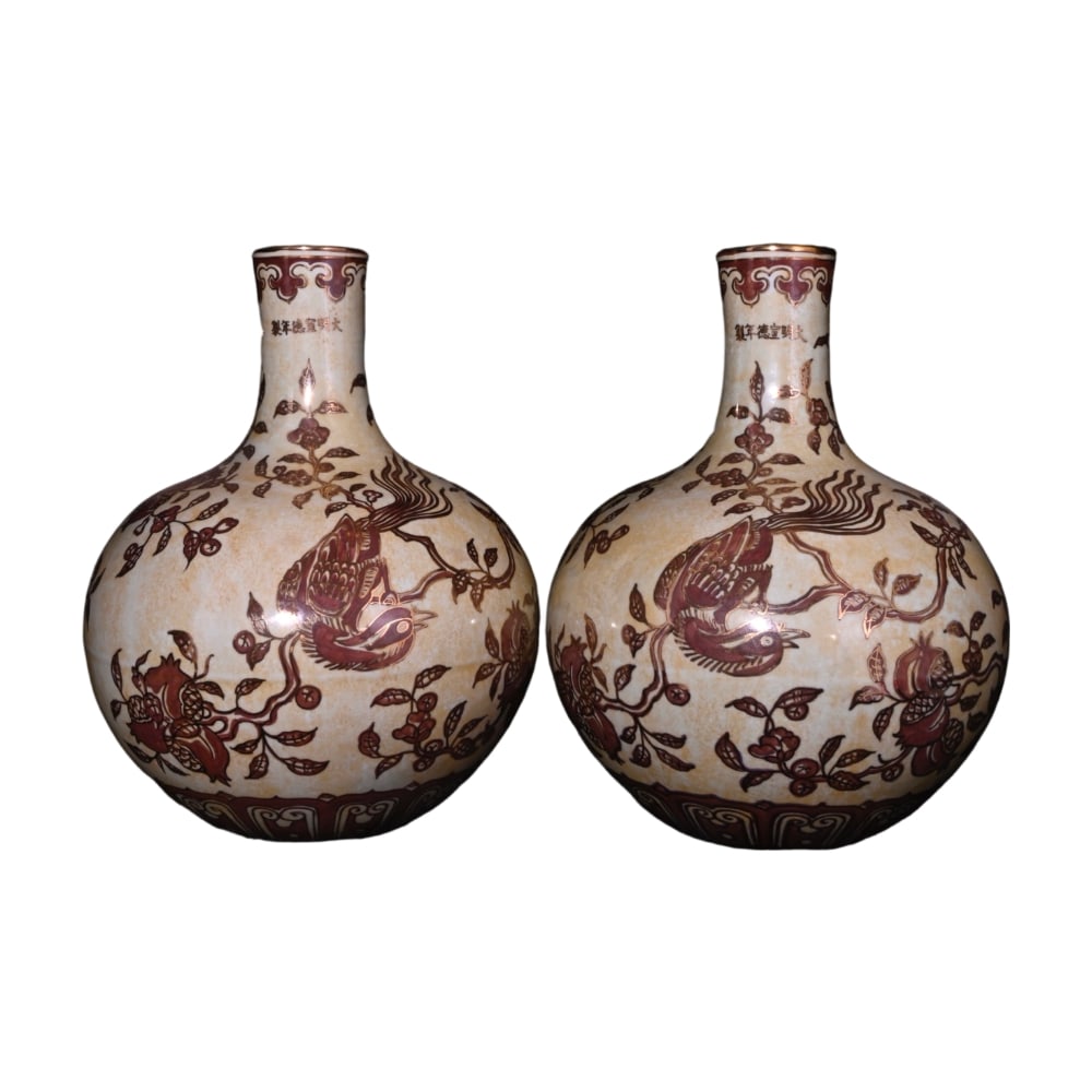 Ming Xuande Underglaze Red and Gilded Floral and Bird Motif Celestial Sphere Vase: This Ming Xuande period underglaze red and gilded floral and bird motif celestial sphere vase exemplifies the exceptional craftsmanship of Ming dynasty ceramics. The underglaze red is rich in color,