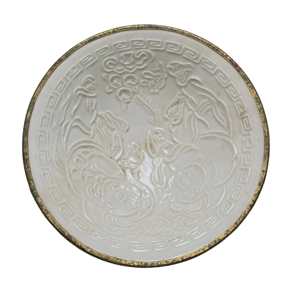 Song Dynasty Ding Kiln Gold-rimmed Small Bowl: This small bowl from the Song Dynasty Ding Kiln is renowned for its ultra-thin body and exquisite gold rim. Ding Kiln porcelain is famous for its jade-like white glaze and delicate texture, and this b