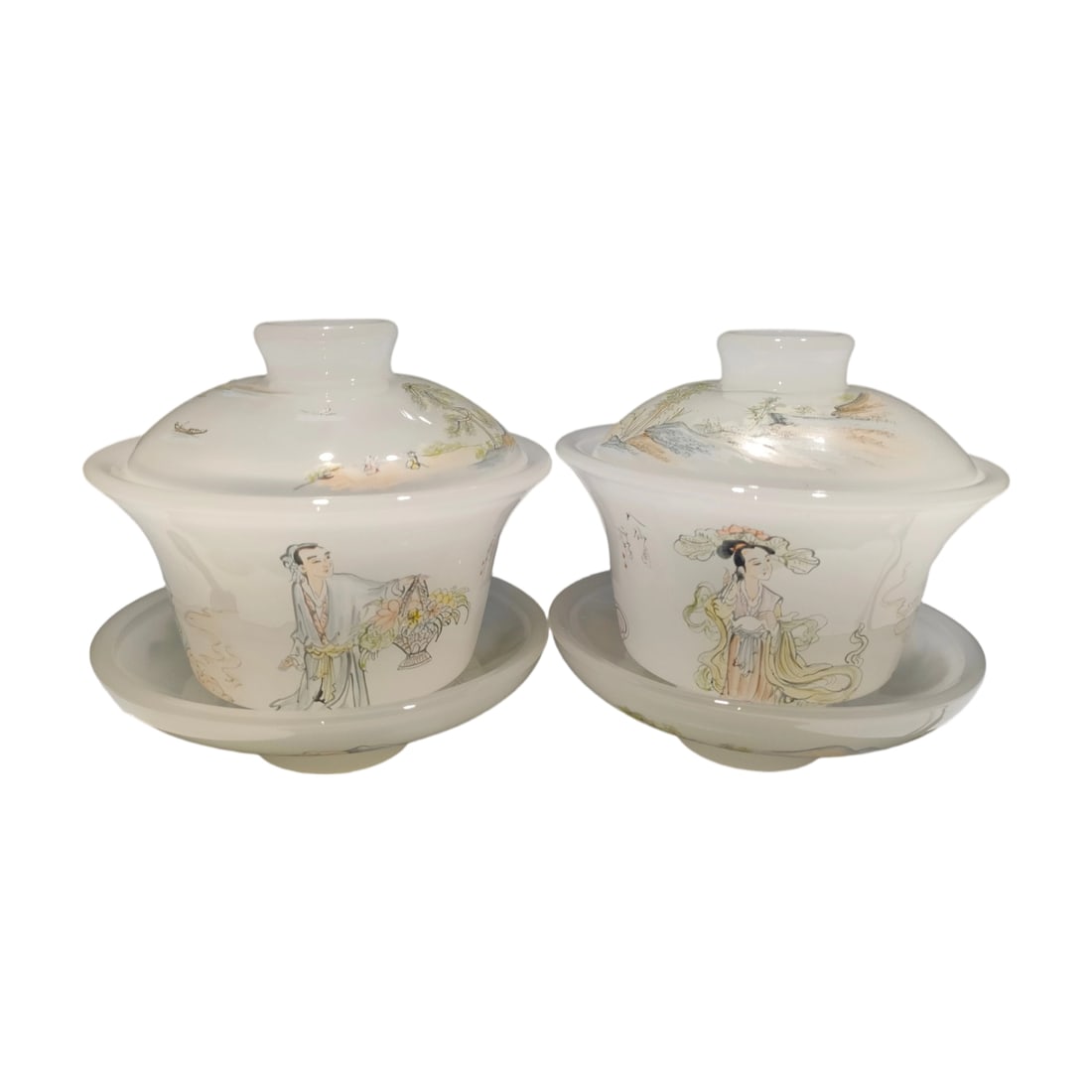 Qing Dynasty Glazed Eight Immortals Covered Bowls: This pair of Qing Dynasty glazed covered bowls features the theme of the Eight Immortals. The glaze is lustrous and firm, with elegant coloring. The brushwork is bold, and the poetry complements the i