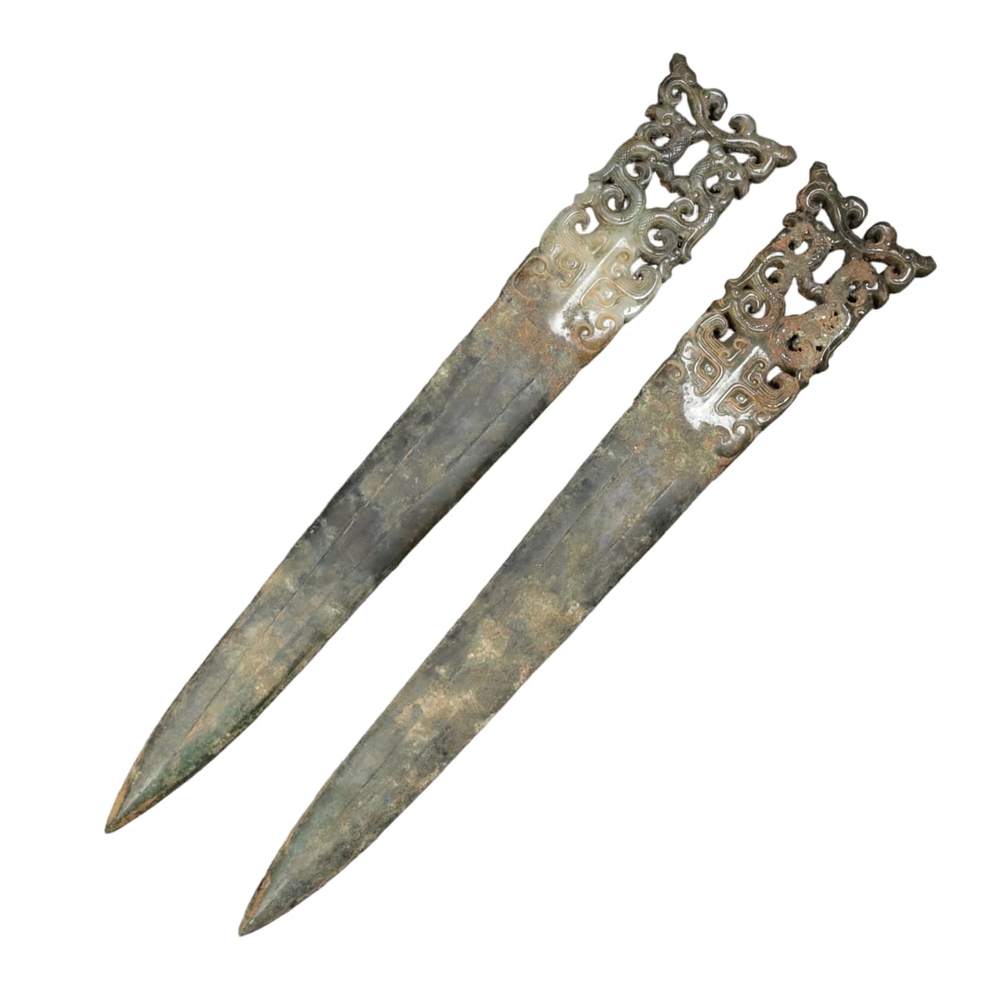 Copper-Wrapped Hetian Jade Weapon: This copper-wrapped Hetian jade weapon features fine and oily jade quality with an aged patina, showcasing the exquisite craftsmanship of ancient times. The detailed work reflects the artisan's superb