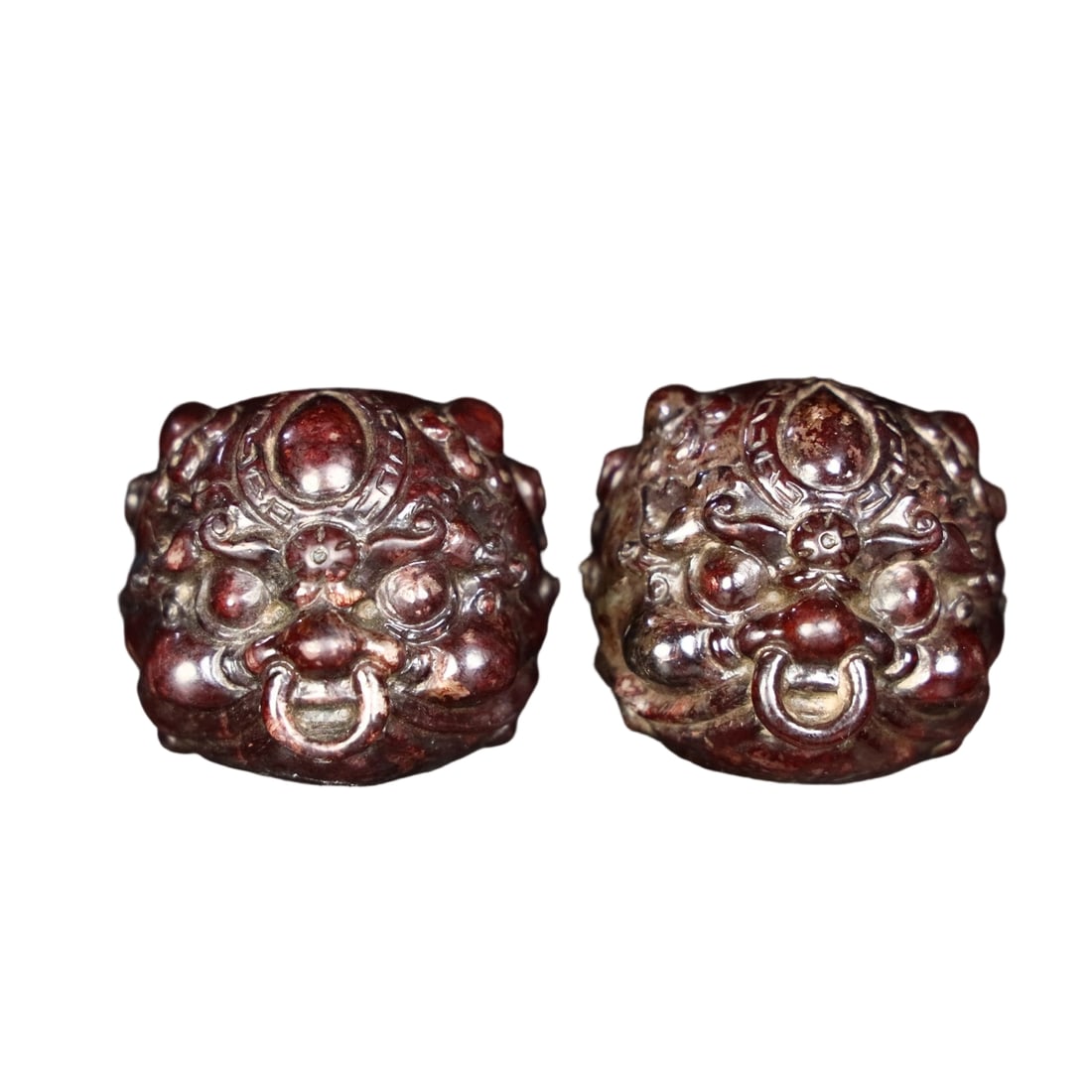 Pair of Hetian Jade Lion Balls: This pair of Hetian jade lion balls features fine jade quality and a well-aged patina, showcasing the exquisite craftsmanship of traditional techniques. The lively details of the carved lions reflect 