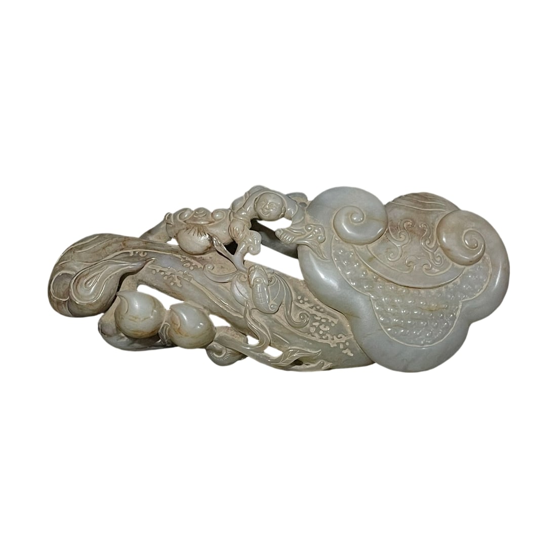 Ming and Qing Dynasty Ancient Jade: This archaic jade Ruyi from the Ming and Qing Dynasties is crafted from Hetian jade, featuring a simple yet elegant form with a natural patina. The piece is of high grade, with clear carvings of child
