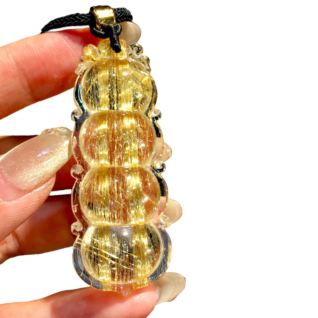 Natural Titanium Crystal Lucky Bean Pendant: This titanium crystal fortune bean pendant is renowned for its exquisite craftsmanship and full shape. The crystal is transparent with a golden color, sourced from old Brazilian mines, exhibiting a