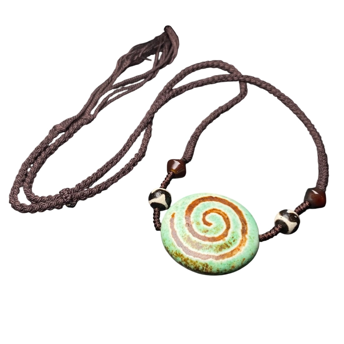 Old High-Oil Patina Barley Offering Six-Eyed Dzi Bead from Tibetan Region: This Dzi bead is crafted from old material with a high-oil patina, reflecting the passage of time. The six-eyed totem symbolizes prosperity and success, representing wisdom and achievement, while the 