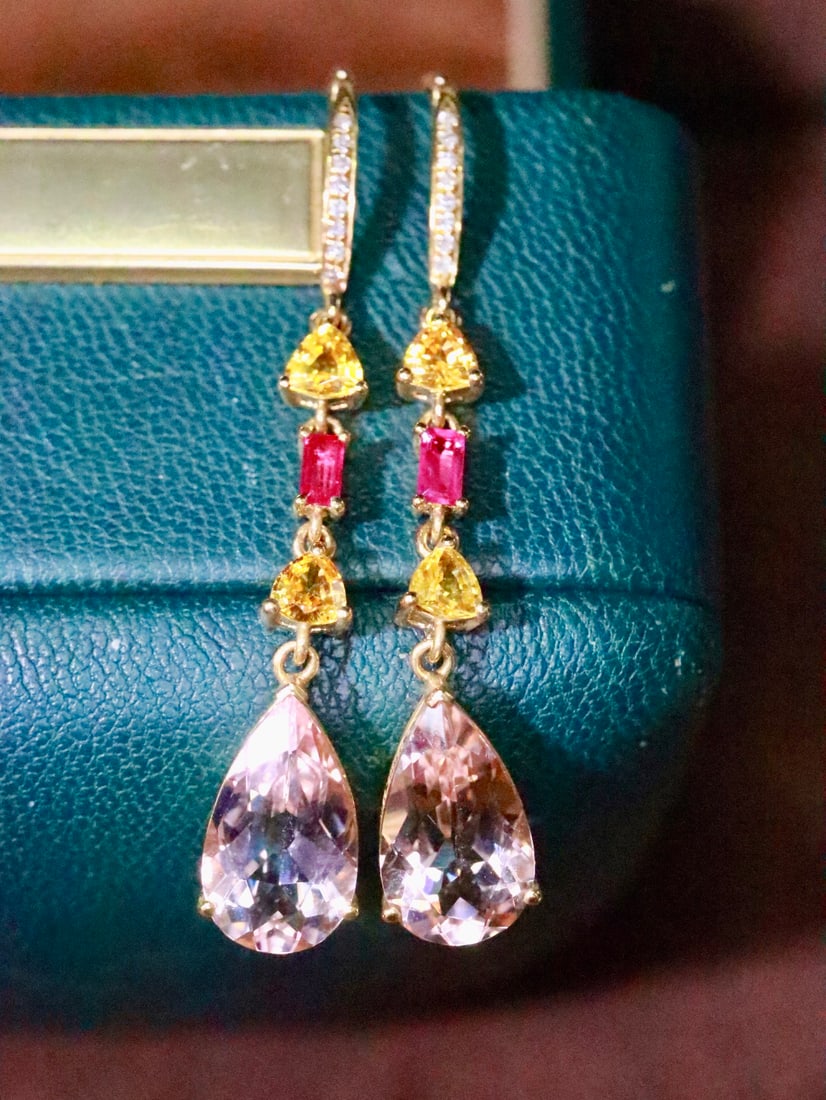 18K Gold Morganite Earrings: These earrings are meticulously crafted in 18K gold, with the morganite's fresh and soft hue bringing a sense of tranquility. The diamond accents add a brilliant sparkle, perfectly showcasing an