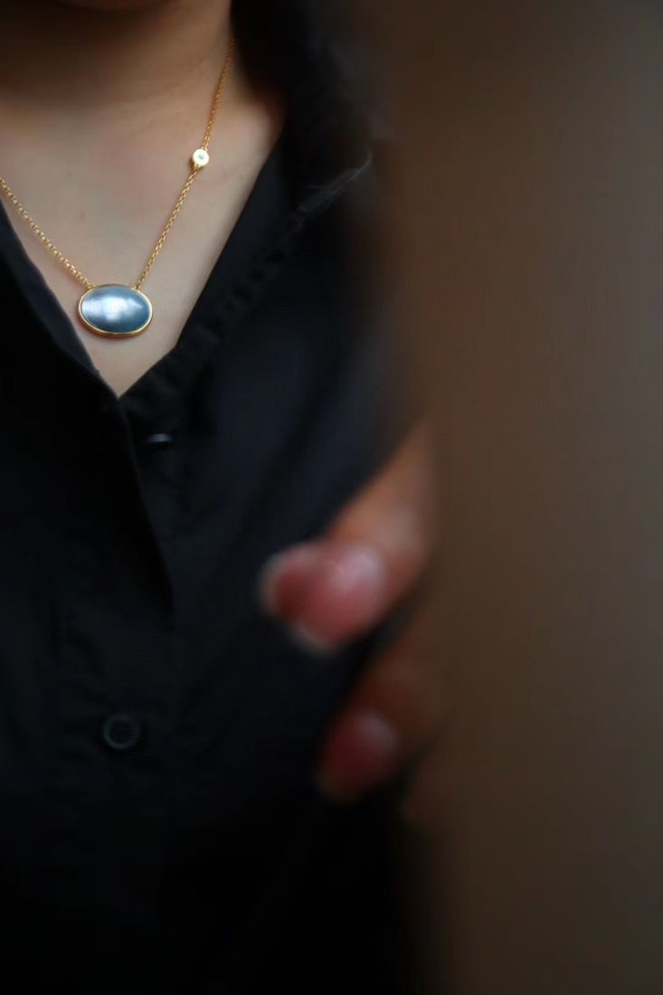 Natural Mabe Pearl and Turquoise Pendant: This pendant features a natural Mabe pearl as the main stone, complemented by natural turquoise, exuding unique elegance and charm. It is crafted with s925 silver plated with 24k gold, ensuring lastin