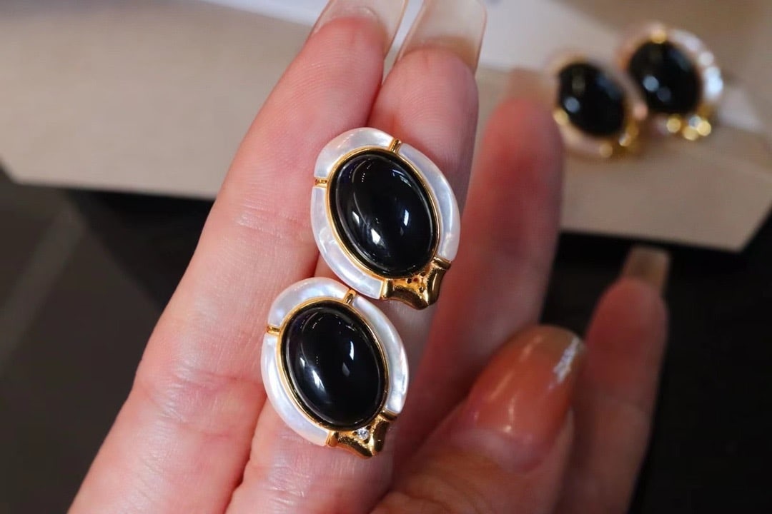 Natural Black Onyx and White Mother-of-Pearl Earrings: These earrings incorporate court-style design elements, showcasing a beautifully vintage style. The combination of natural black onyx and white mother-of-pearl adds a unique texture. Made with s928 si