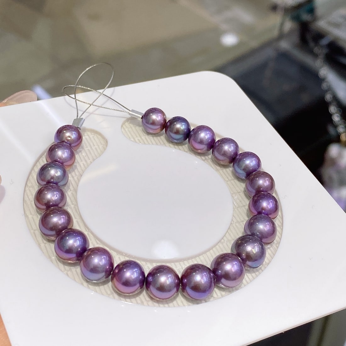 Deep Purple Edison Pearl Bracelet: This bracelet is composed of carefully selected deep purple Edison pearls, each showcasing its unique charm. The pearls are perfectly round with minimal blemishes, offering a very clean appearance. (P