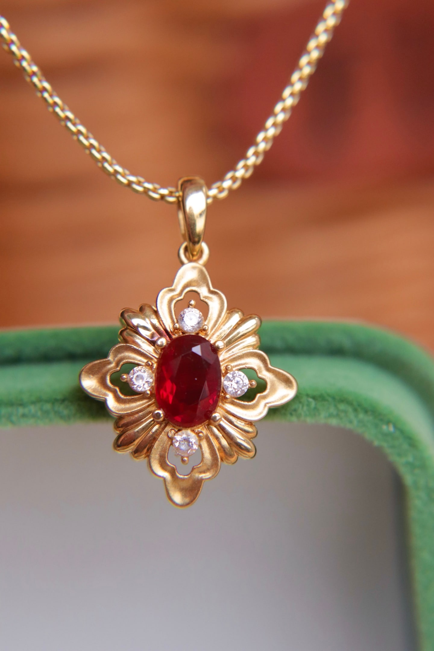 18K Gold Sunstone Pendant: This 18K gold sunstone pendant showcases a unique design, with a clean crystal and captivating color. Perfect for collectors seeking individuality and quality. Freight: 1.International Freight: