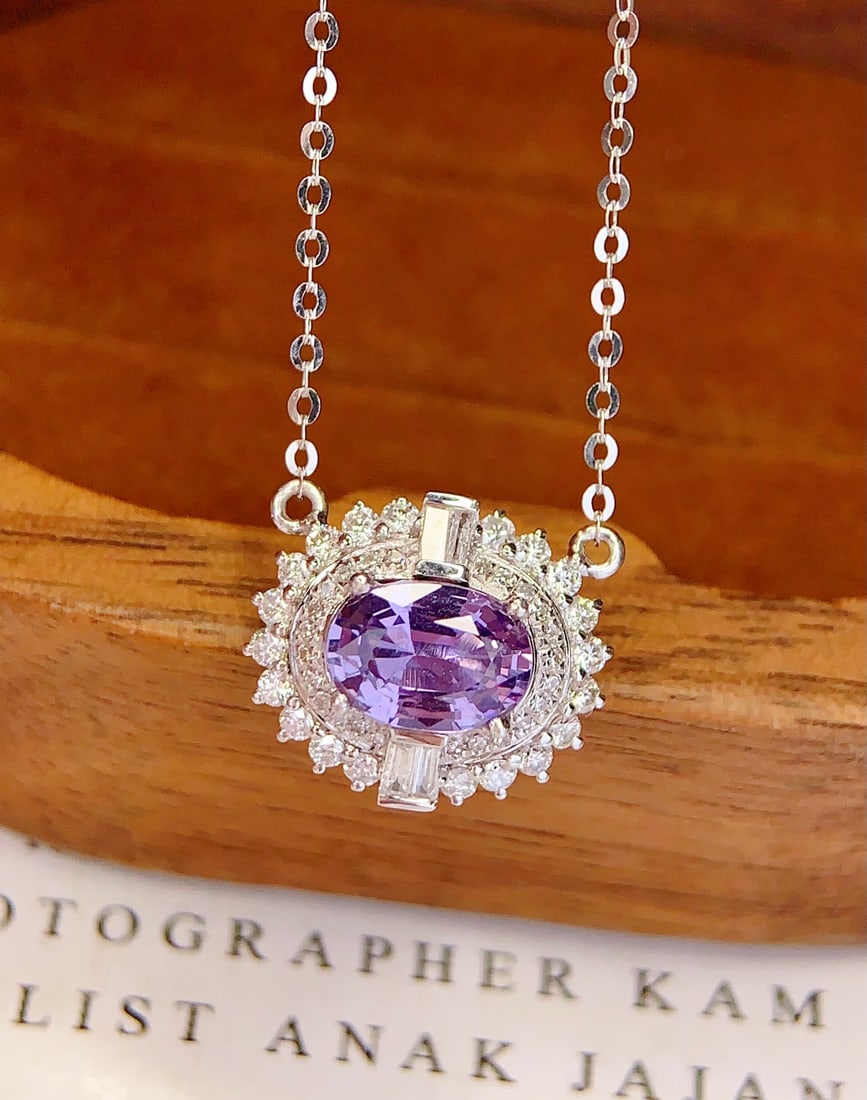 18K Gold Natural Unheated Color Blue Sapphire Necklace: This necklace is meticulously crafted in 18K gold, showcasing the unique charm of the natural unheated color blue sapphire. The brilliance of the main stone complements the 48 diamonds, exuding noble