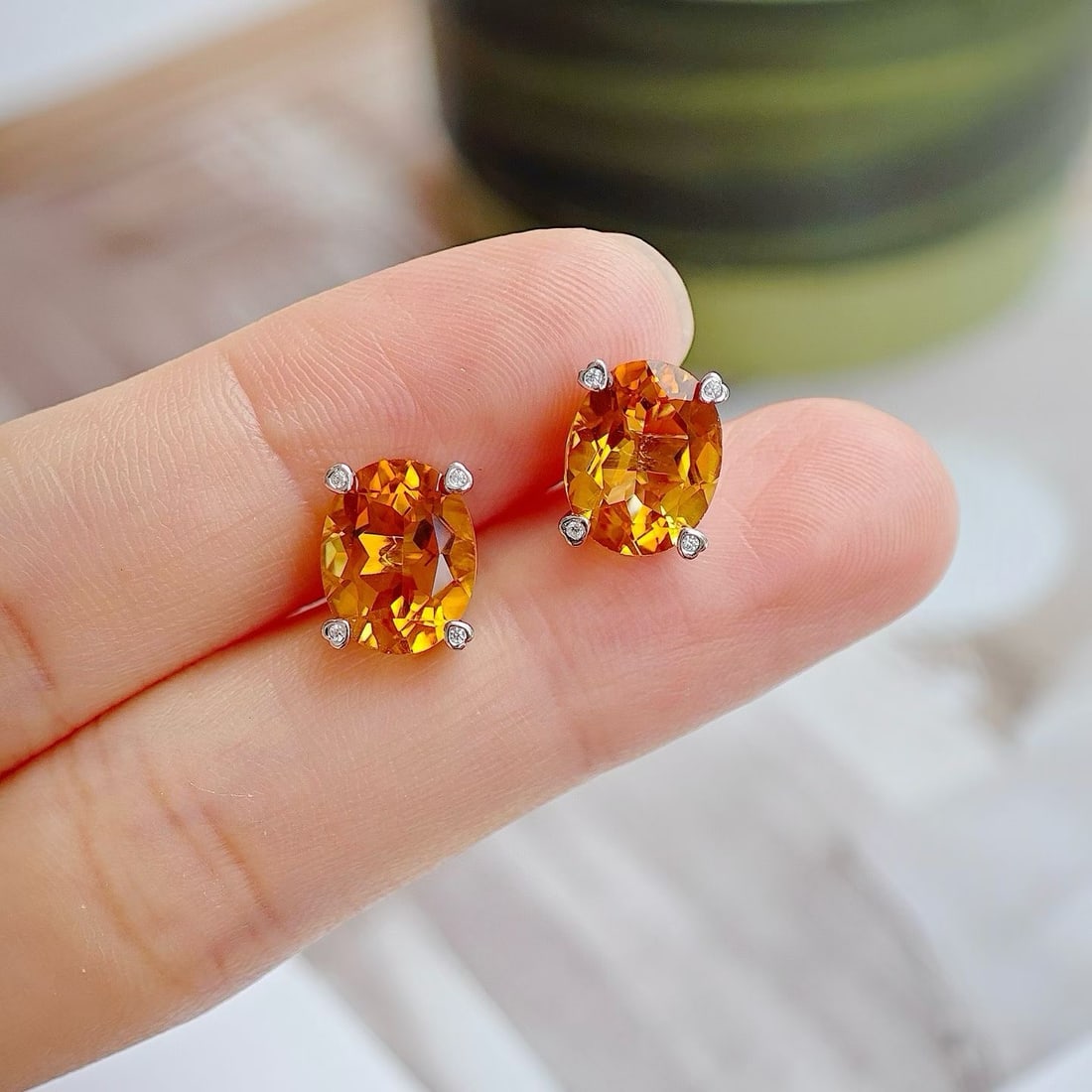 925 Silver Natural Citrine Earrings: These earrings are meticulously set with natural citrine in 925 silver, featuring a unique heart-shaped prong design. The citrine displays a captivating brilliance under light, enhancing the wearer's 