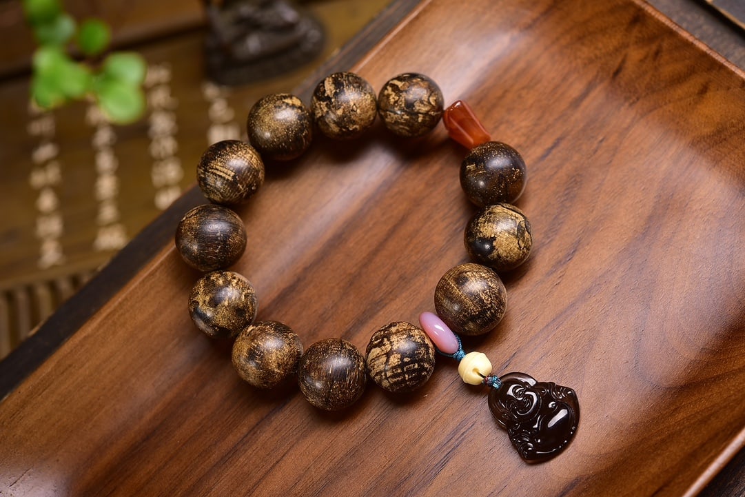 Natural Agarwood Bracelet: This bracelet is made from natural wild old agarwood, with each bead full and rich in honey fragrance, floral sweetness, and a strong cool aroma. Paired with South Red Agate, Red Agate safety buckle, 
