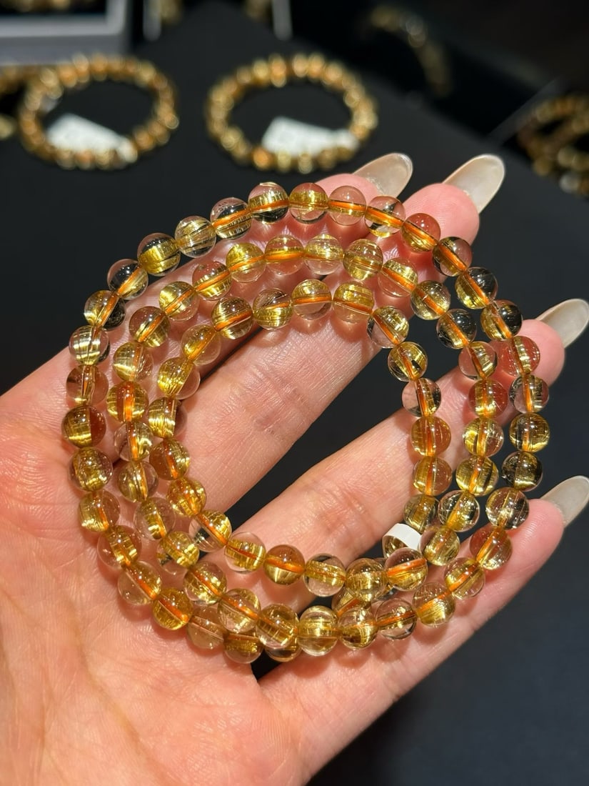 Natural Rutilated Quartz Bracelet: This bracelet is made of natural rutilated quartz, featuring clean crystals and a strong rutilation effect. The golden hue is stunning, offering not just a visual delight but also an elegant lifestyle
