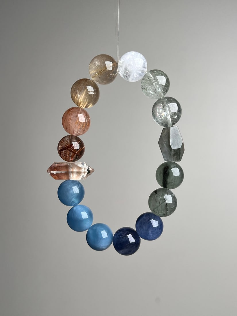 Natural Crystal Bracelet: This natural crystal bracelet is composed of various precious crystals, showcasing natural beauty and harmony. Each bead is carefully selected, and the approximately 12mm size makes it comfortable and