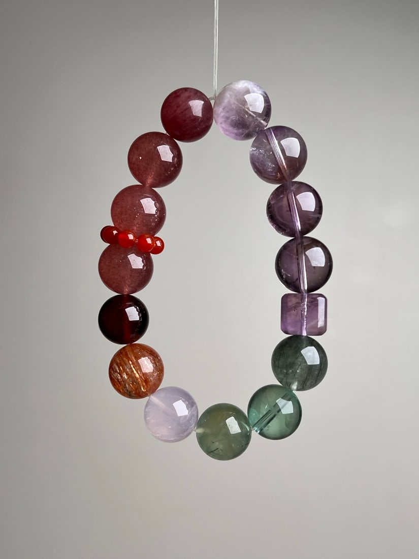 Natural Crystal Bracelet: This natural crystal bracelet is composed of various precious natural gemstones, showcasing unique colors and textures. Each bead is carefully selected, perfectly combining the beauty and energy of am