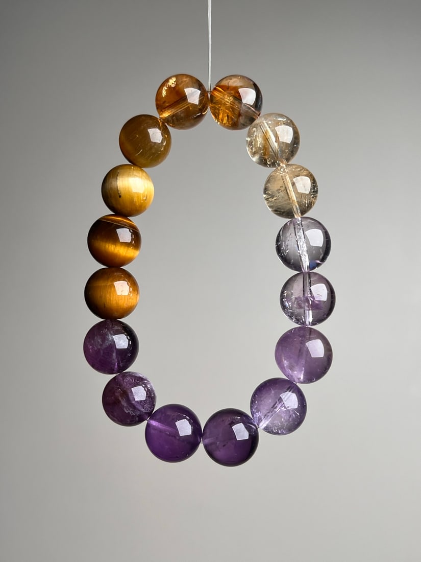 Natural Crystal Bracelet: This natural crystal bracelet is composed of various precious crystals, showcasing natural beauty and harmony. Each bead is carefully selected, and the approximately 12mm size makes it comfortable to 