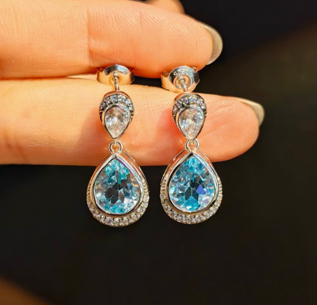 925 Silver Natural Topaz Earrings: These earrings are meticulously crafted in 925 silver, set with natural topaz that exudes a captivating brilliance. The accompanying natural white crystal design adds an elegant touch to the earrings.