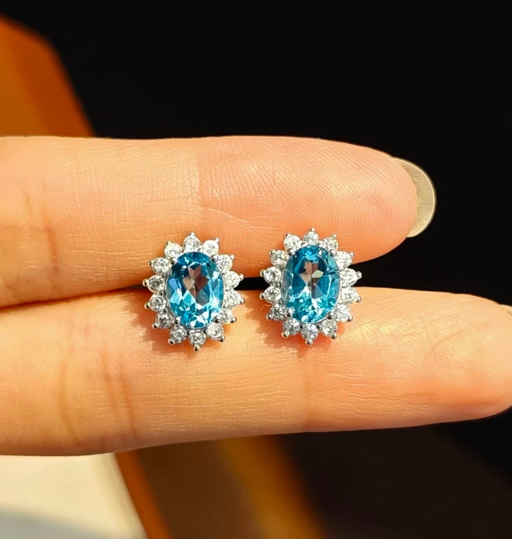 925 Silver Natural Topaz Earrings: These earrings feature natural topaz set in 925 silver, showcasing a simple yet elegant style. The fresh hue of the topaz adds a touch of brilliance to the overall design. Suitable for various occasio