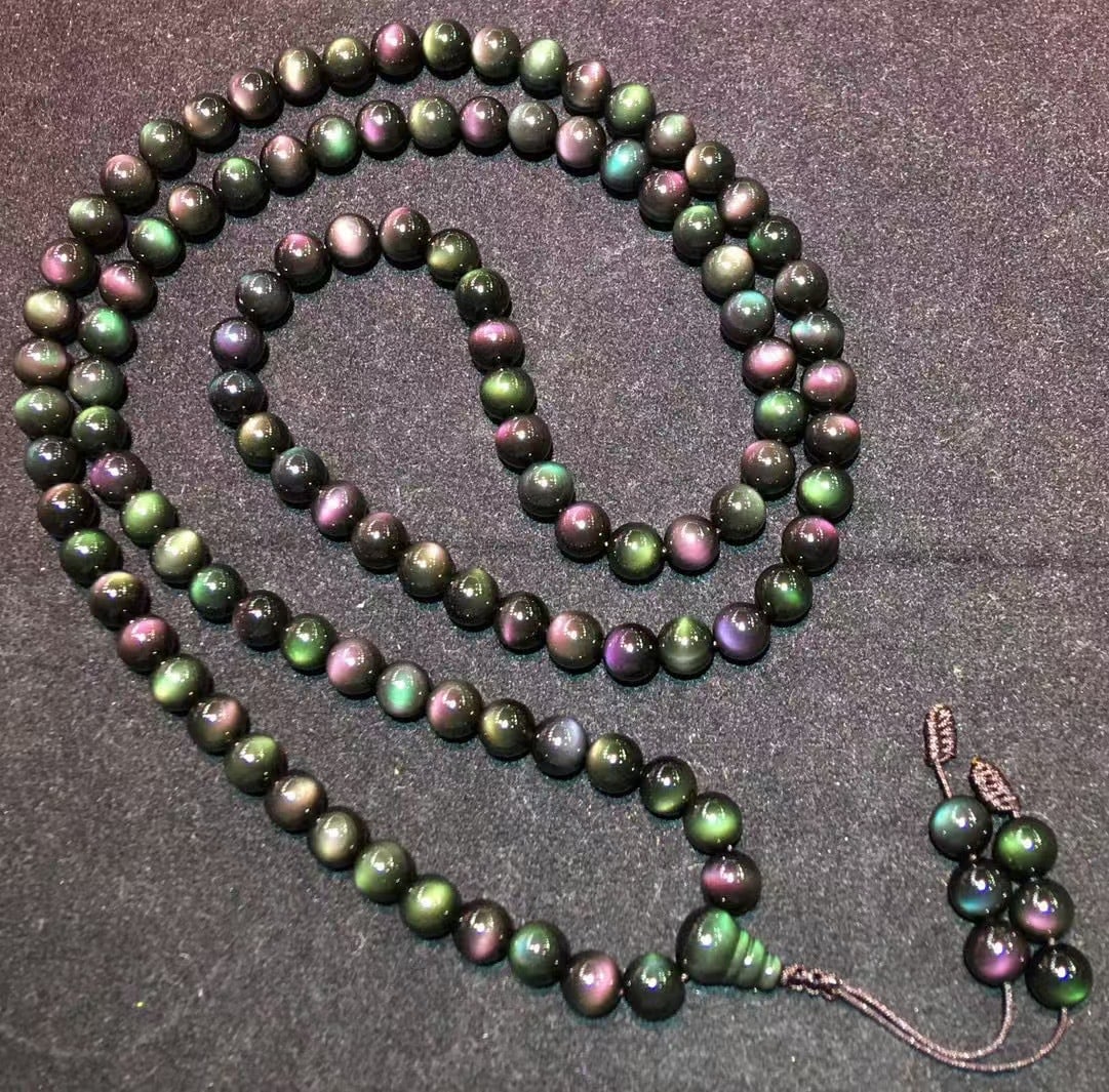 Natural Obsidian Prayer Beads Bracelet: This natural obsidian prayer beads bracelet consists of 108 beads, each 8mm in diameter, showcasing a dazzling full moon eye effect, lively and radiant. The design is simple and elegant, suitable for 